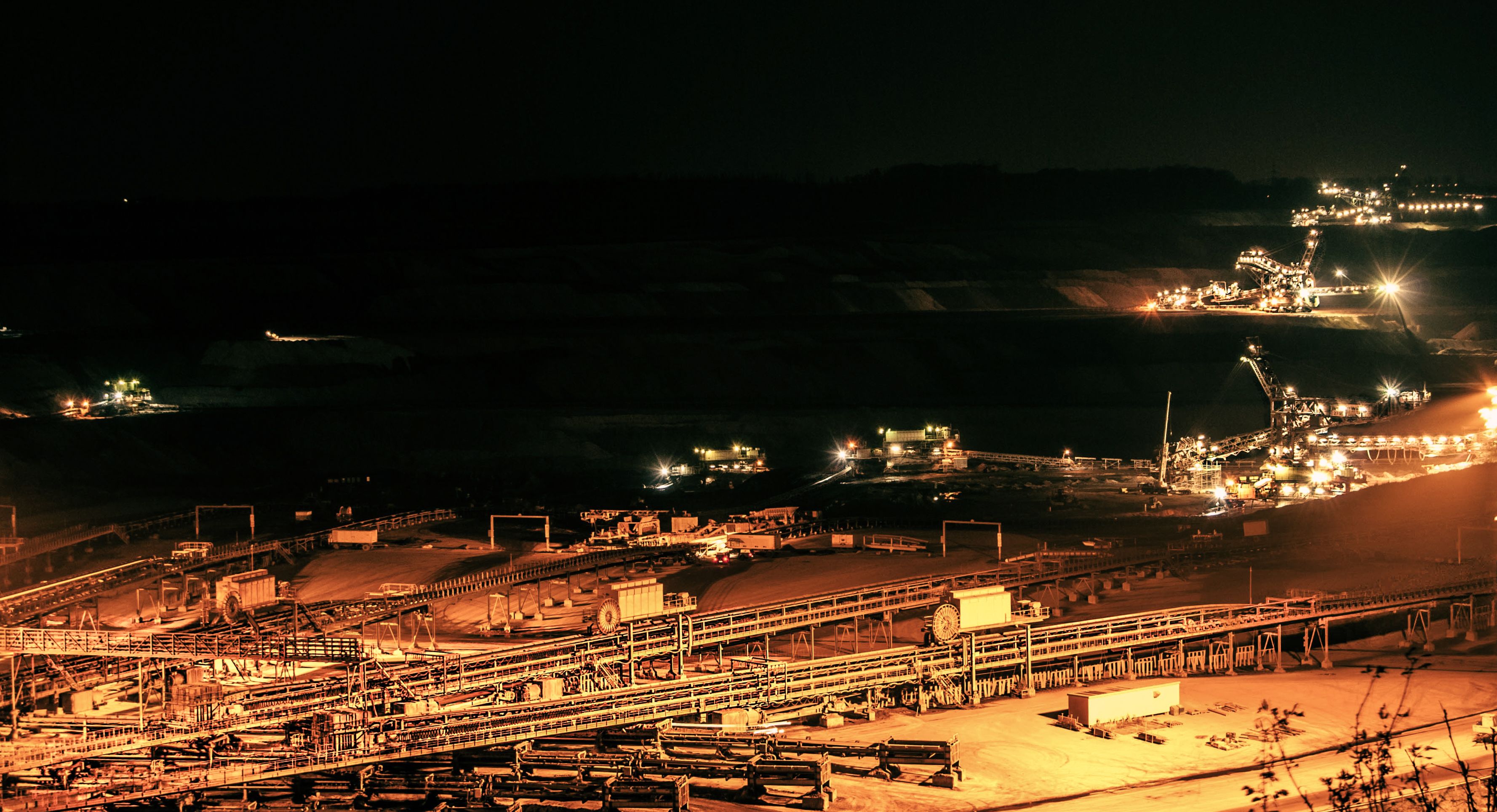 Open-pit mining operation at dusk